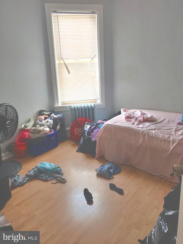 bedroom featuring hardwood / wood-style floors