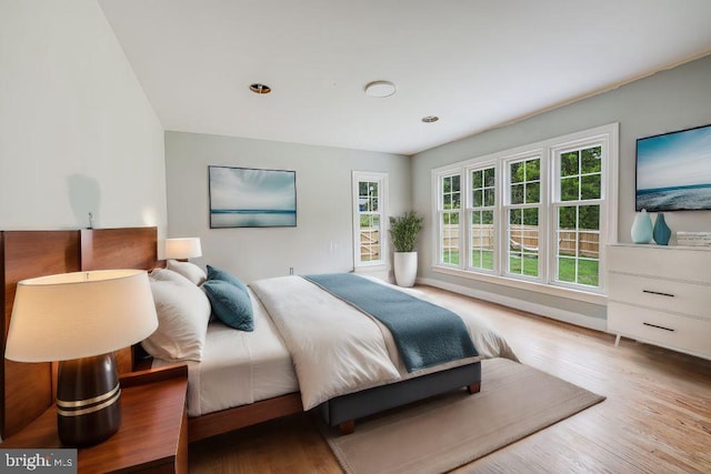 bedroom with light wood-type flooring