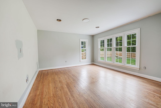 spare room featuring light hardwood / wood-style flooring