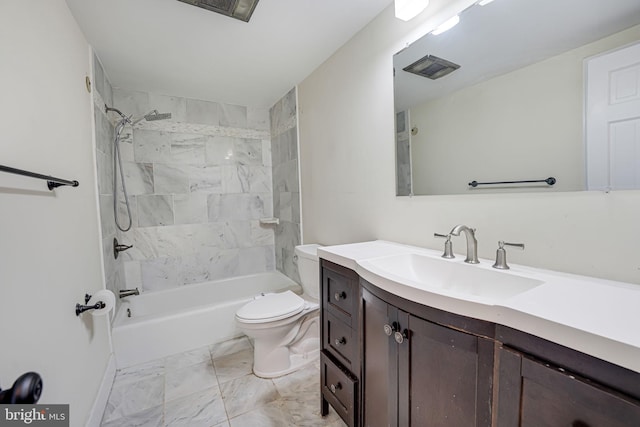 full bathroom featuring toilet, tiled shower / bath, and vanity