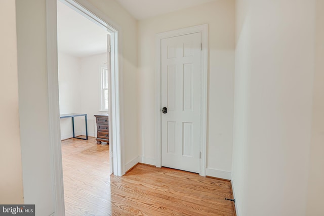 hall with light hardwood / wood-style flooring