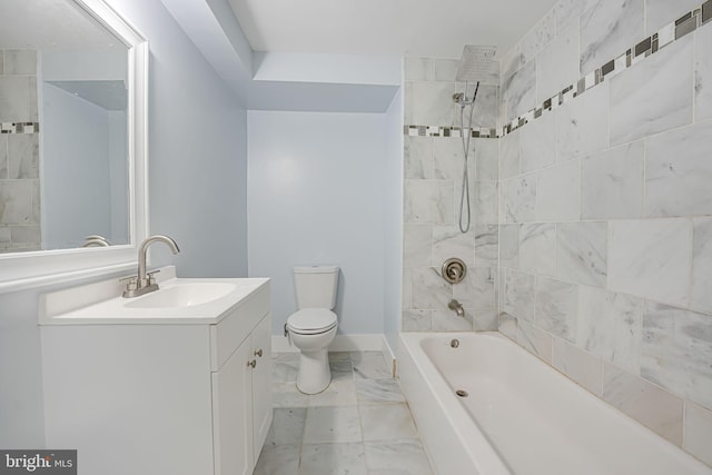 full bathroom with toilet, tiled shower / bath, and vanity