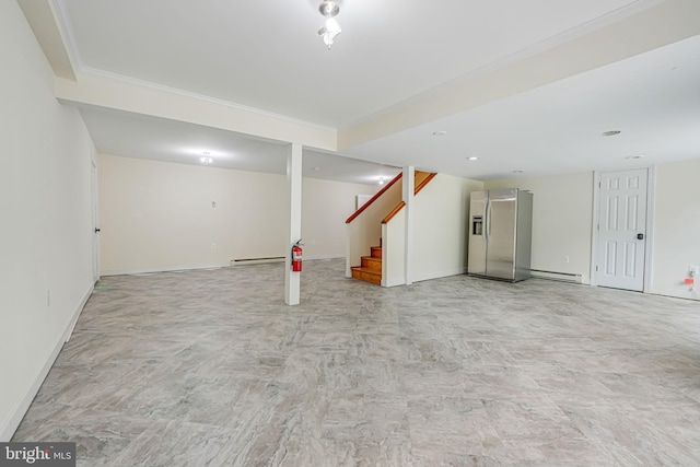 basement featuring a baseboard heating unit and stainless steel fridge