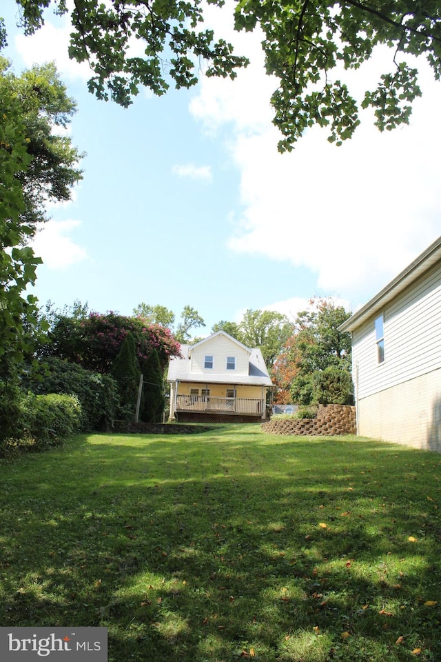 view of yard with a wooden deck