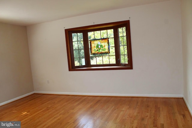 spare room with light hardwood / wood-style flooring