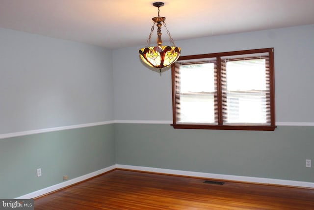 empty room featuring wood-type flooring