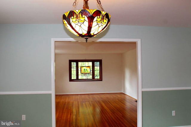 unfurnished room featuring hardwood / wood-style floors