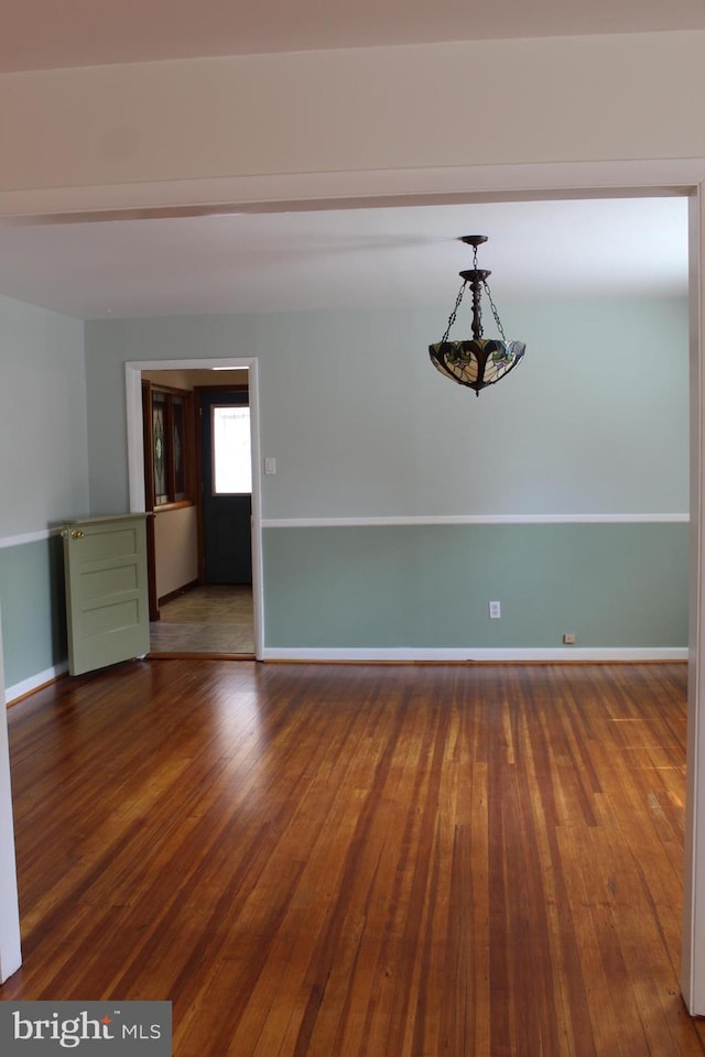 unfurnished room featuring hardwood / wood-style floors