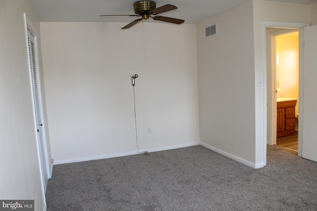 unfurnished bedroom featuring ceiling fan and carpet floors