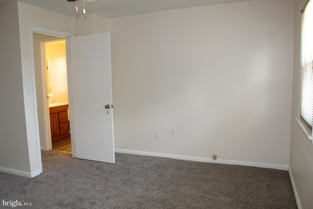 unfurnished bedroom featuring carpet