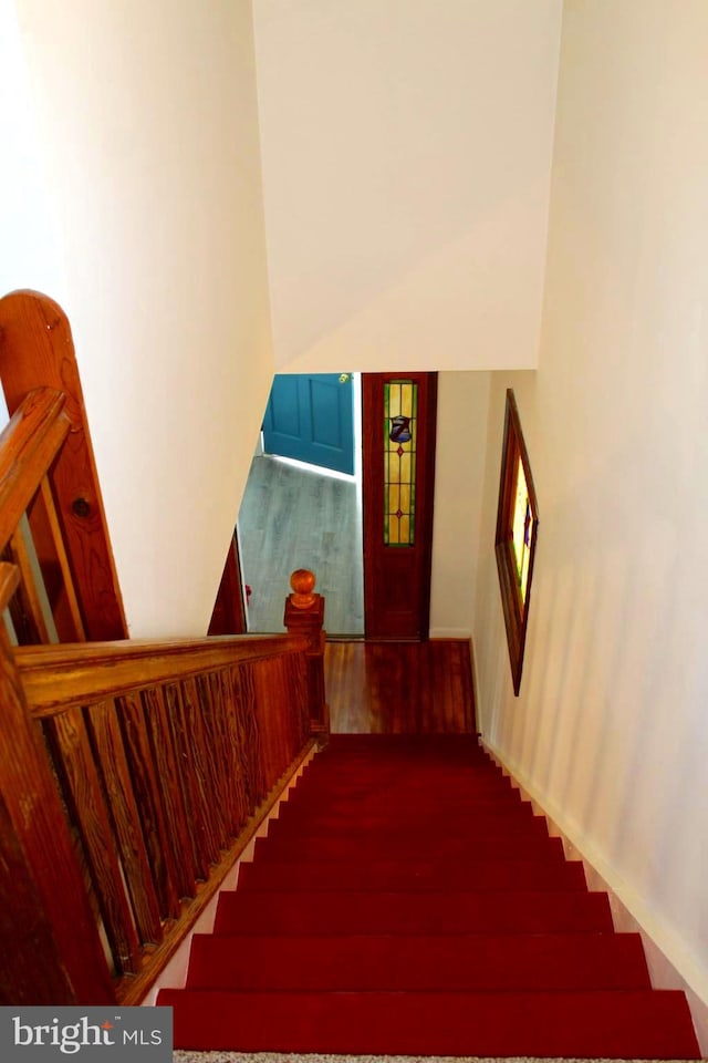 stairs with wood-type flooring