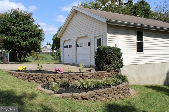 garage featuring a yard