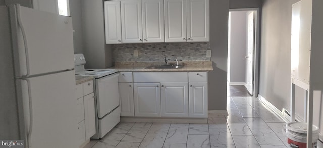 kitchen with sink, backsplash, white cabinets, and white appliances