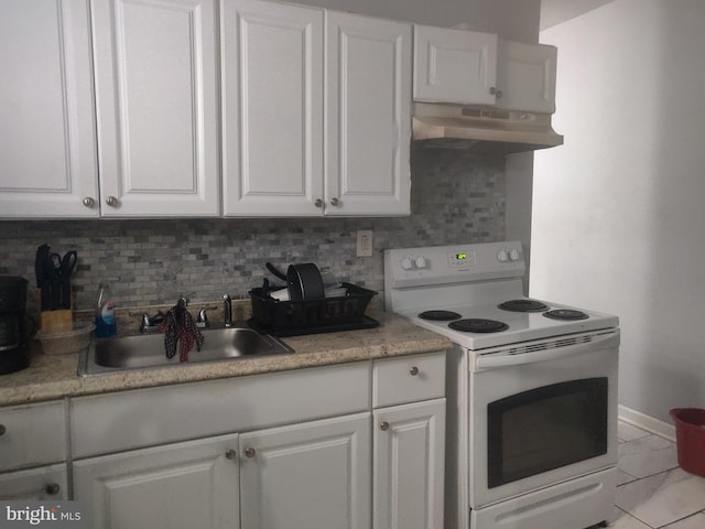 kitchen with decorative backsplash, white cabinetry, and white electric stove