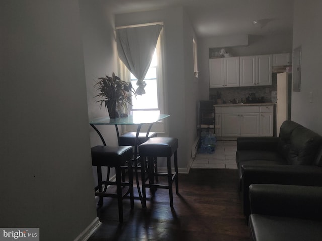 dining area with dark hardwood / wood-style flooring