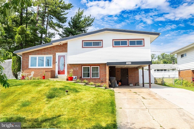 view of front facade with a front yard and a carport