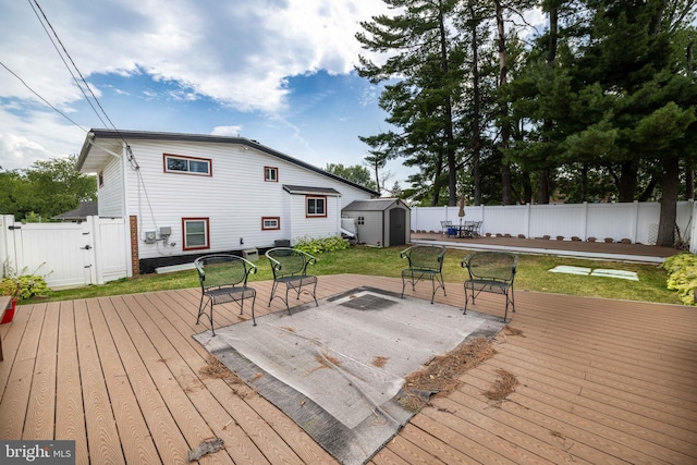 wooden terrace with a storage unit and a patio