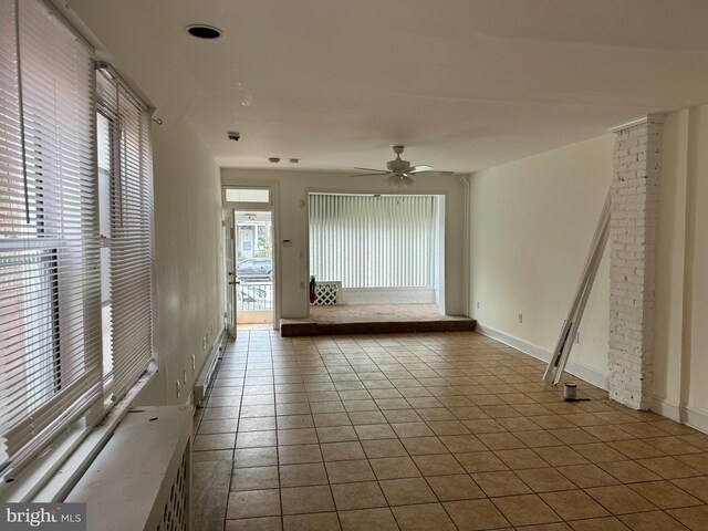 1717 W 4th St, Wilmington, DE 19805 - empty room featuring ceiling fan, tile patterned flooring, baseboards, and a baseboard radiator