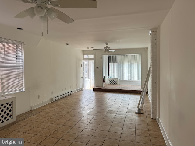 1717 W 4th St, Wilmington, DE 19805 - spare room with a baseboard radiator, a ceiling fan, tile patterned flooring, and baseboards
