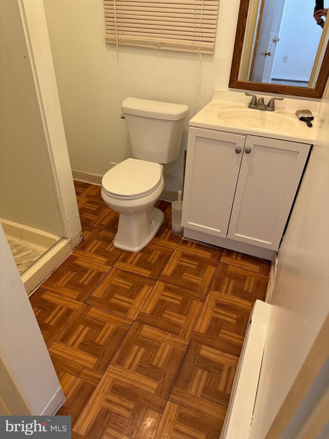 1717 W 4th St, Wilmington, DE 19805 - bathroom featuring toilet, vanity, and a shower