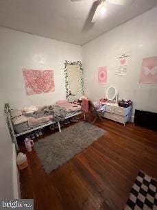 miscellaneous room with ceiling fan and dark hardwood / wood-style flooring