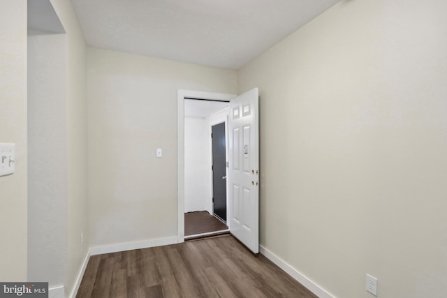 spare room featuring hardwood / wood-style flooring