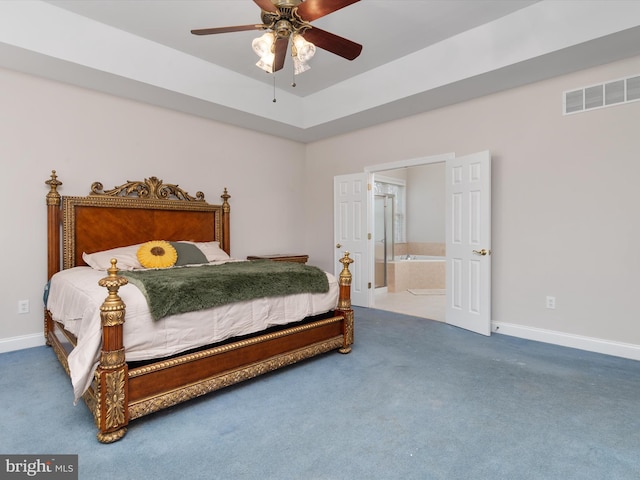 bedroom with carpet, ceiling fan, and ensuite bath