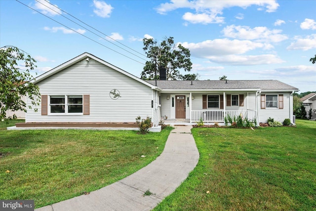 single story home featuring covered porch and a front yard