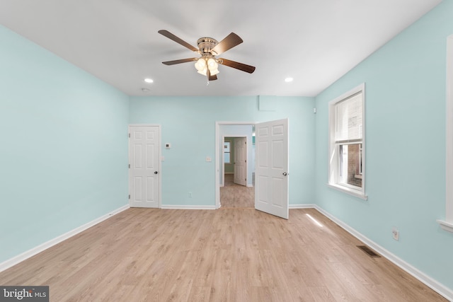 unfurnished bedroom featuring light hardwood / wood-style floors and ceiling fan