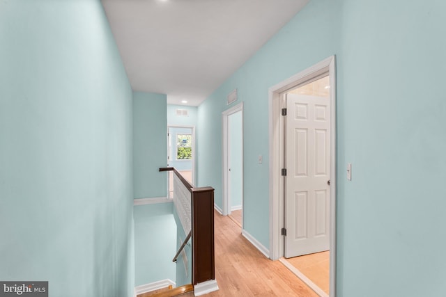 corridor featuring light hardwood / wood-style floors