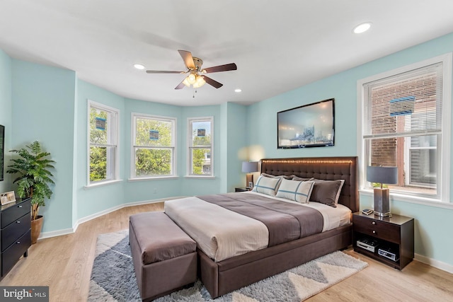 bedroom featuring ceiling fan and light hardwood / wood-style floors