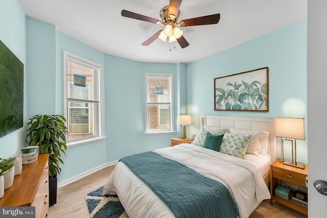 bedroom featuring ceiling fan and light hardwood / wood-style flooring