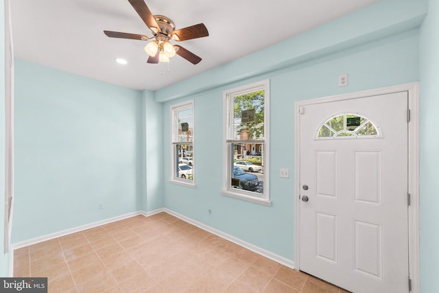 foyer featuring ceiling fan