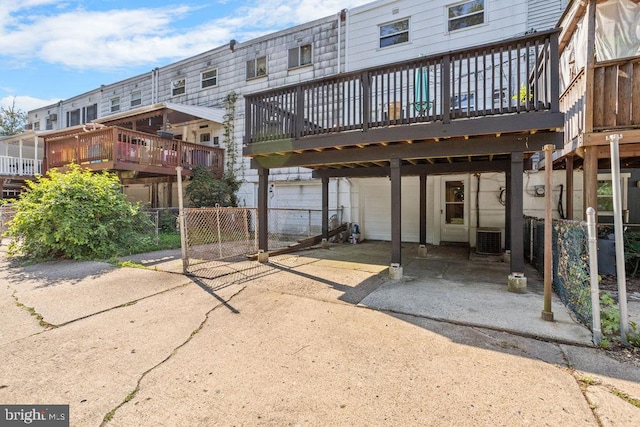 back of house with a wooden deck