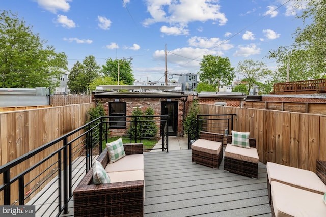 wooden deck with an outdoor living space