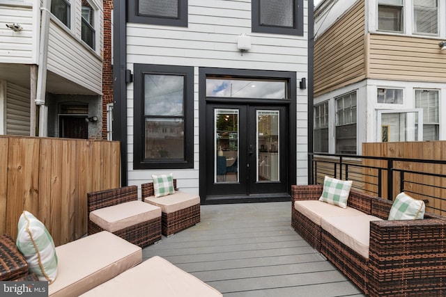 deck with outdoor lounge area and french doors