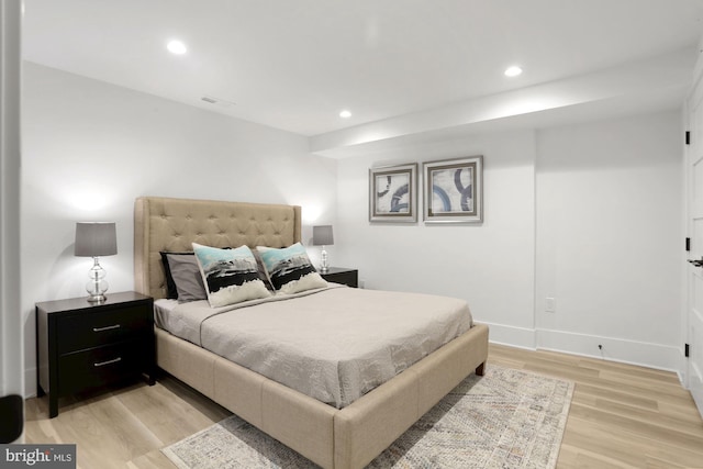 bedroom with light hardwood / wood-style flooring