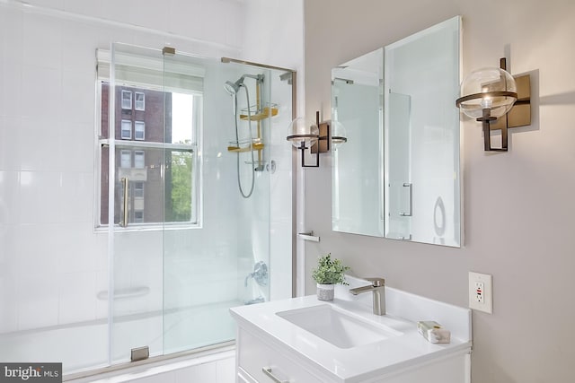 bathroom featuring vanity, plenty of natural light, and an enclosed shower