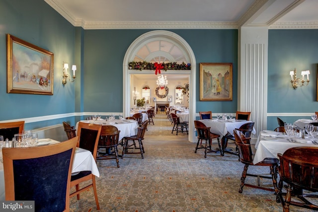 dining area featuring crown molding and wood-type flooring