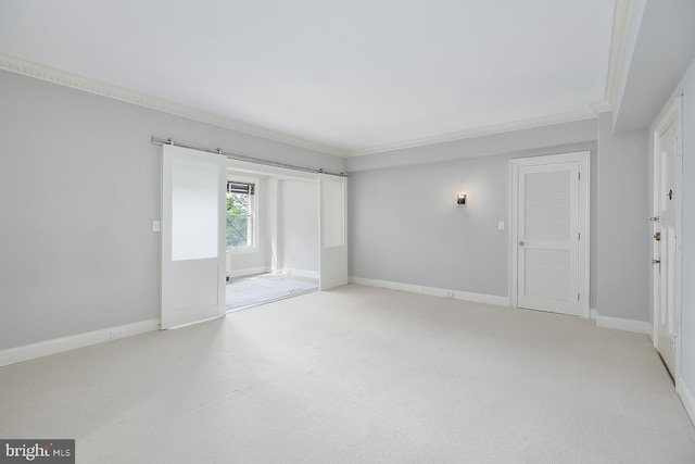 empty room with carpet flooring and ornamental molding