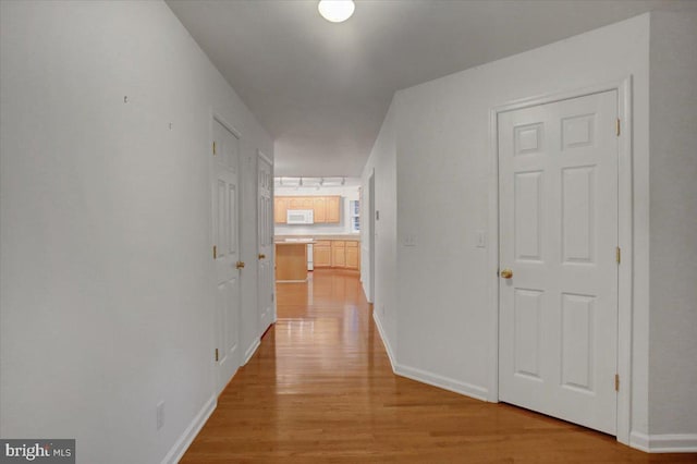 hallway featuring light wood-type flooring