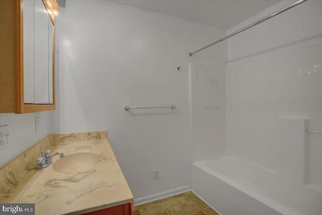 bathroom with tile patterned floors, vanity, and bathtub / shower combination