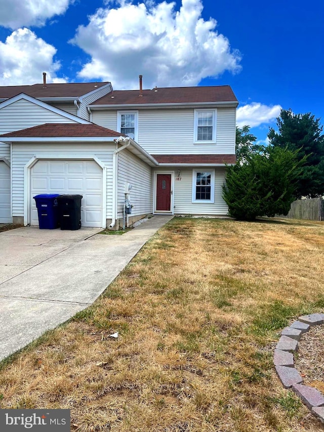 front of property featuring a garage and a front lawn