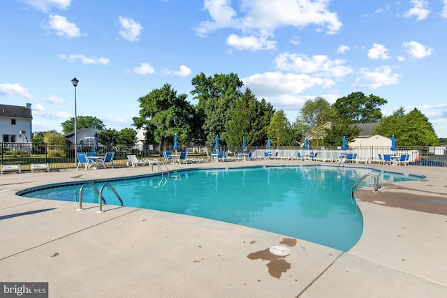 view of swimming pool featuring a patio