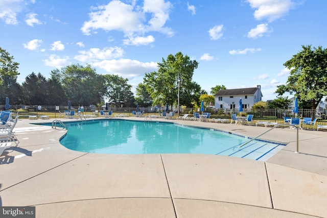 view of swimming pool with a patio