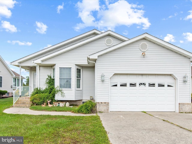 view of front facade with a front yard and a garage