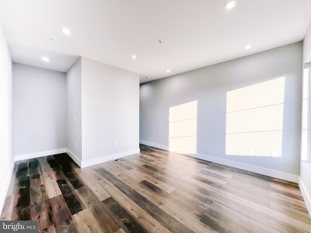 spare room featuring hardwood / wood-style floors