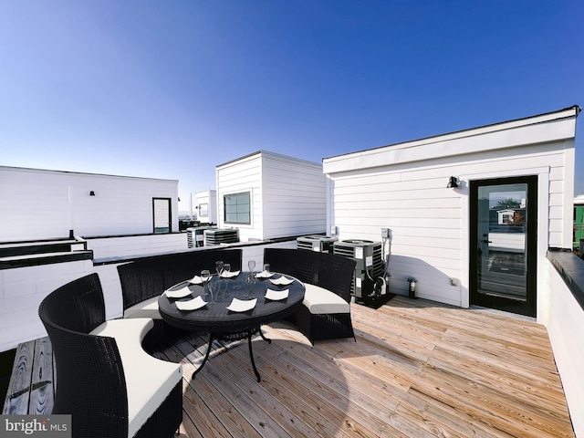 wooden deck with an outdoor living space