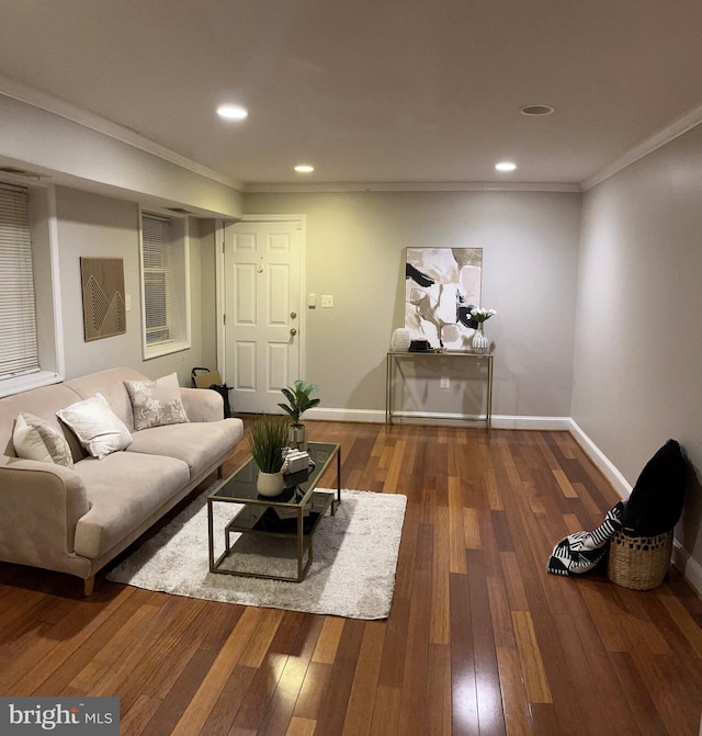 living room with dark hardwood / wood-style flooring and ornamental molding