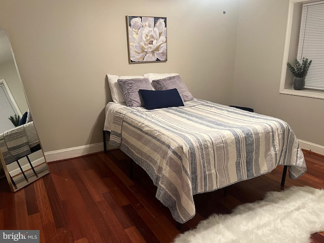 bedroom featuring dark hardwood / wood-style floors